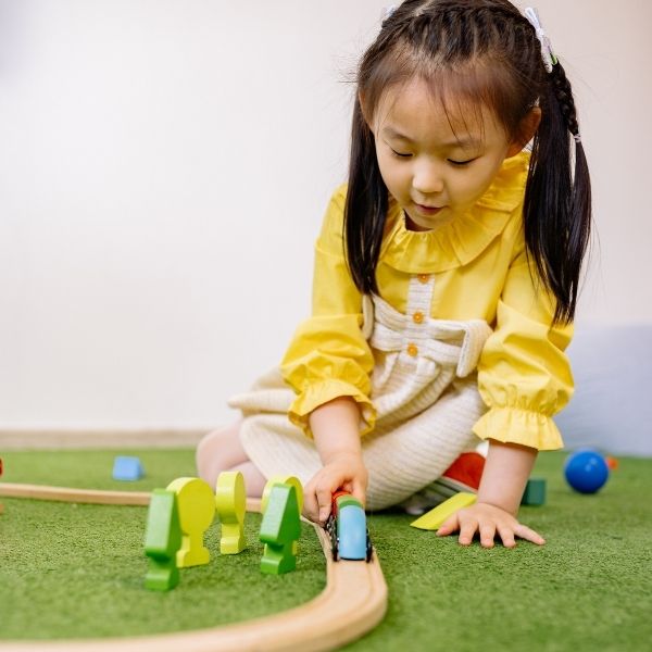 preschooler playing with toys