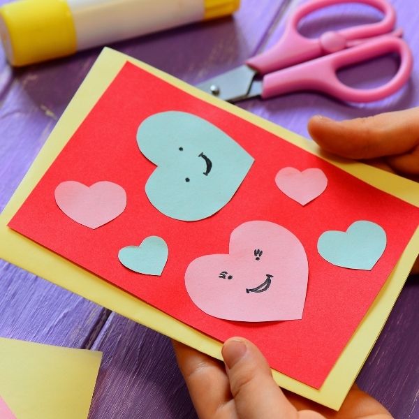 a child crafting a card